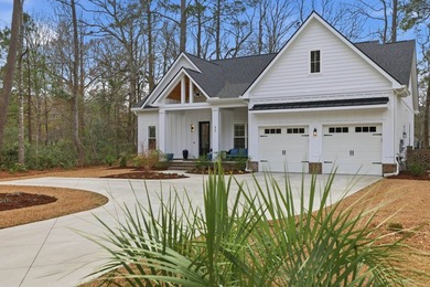 Set within the gated elegance of Pawleys Plantation Golf & on Pawleys Plantation Golf and Country Club in South Carolina - for sale on GolfHomes.com, golf home, golf lot
