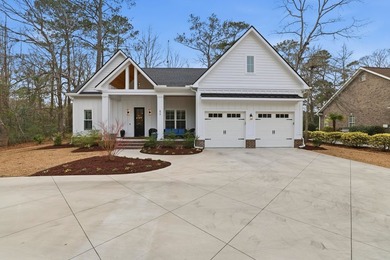 Set within the gated elegance of Pawleys Plantation Golf & on Pawleys Plantation Golf and Country Club in South Carolina - for sale on GolfHomes.com, golf home, golf lot