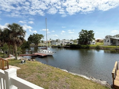 Spacious WATERFRONT Gulf access 2005 manufactured home located on Saint Andrews South Golf Club in Florida - for sale on GolfHomes.com, golf home, golf lot