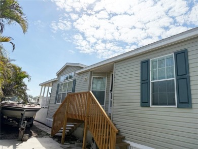 Spacious WATERFRONT Gulf access 2005 manufactured home located on Saint Andrews South Golf Club in Florida - for sale on GolfHomes.com, golf home, golf lot