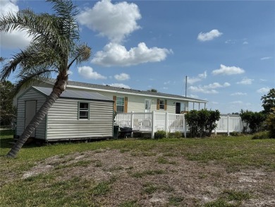 Spacious WATERFRONT Gulf access 2005 manufactured home located on Saint Andrews South Golf Club in Florida - for sale on GolfHomes.com, golf home, golf lot