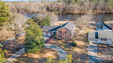 Welcome to this stately brick riverfront home nestled in the on River Bend Golf and Country Club in North Carolina - for sale on GolfHomes.com, golf home, golf lot