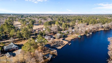 Welcome to this stately brick riverfront home nestled in the on River Bend Golf and Country Club in North Carolina - for sale on GolfHomes.com, golf home, golf lot