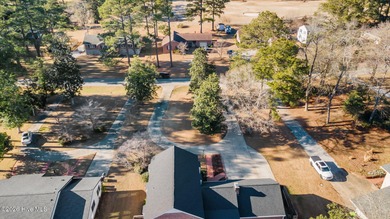 Welcome to this stately brick riverfront home nestled in the on River Bend Golf and Country Club in North Carolina - for sale on GolfHomes.com, golf home, golf lot