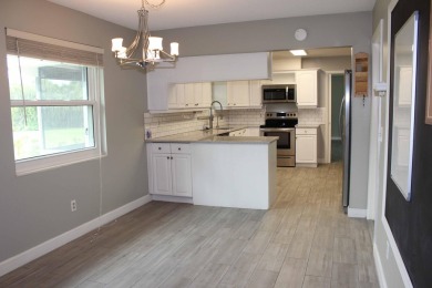 Your own private paradise in this 3/2/2 CBS home in desirable on Martin County Golf Course in Florida - for sale on GolfHomes.com, golf home, golf lot
