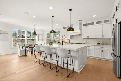 Discover this stunning new construction perched directly on on Harbor Club Golf and Country Club in Georgia - for sale on GolfHomes.com, golf home, golf lot