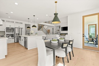 Discover this stunning new construction perched directly on on Harbor Club Golf and Country Club in Georgia - for sale on GolfHomes.com, golf home, golf lot