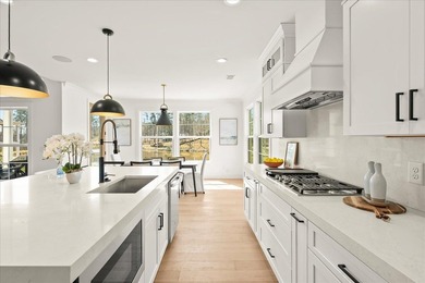 Discover this stunning new construction perched directly on on Harbor Club Golf and Country Club in Georgia - for sale on GolfHomes.com, golf home, golf lot