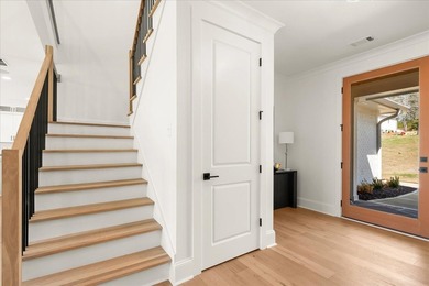 Discover this stunning new construction perched directly on on Harbor Club Golf and Country Club in Georgia - for sale on GolfHomes.com, golf home, golf lot