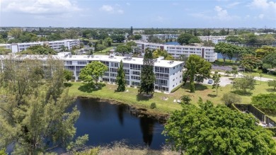 LOCATION LOCATION!!! HIGHLY DESIRABLE CORNER UNIT ON THE TOP on Hillsboro Pines Golf in Florida - for sale on GolfHomes.com, golf home, golf lot
