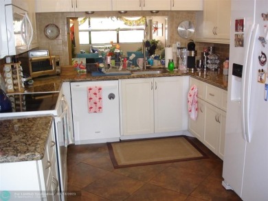 This 1st floor inside corner condo has an assigned parking spot on Sunrise Lakes Phase IV Golf Course in Florida - for sale on GolfHomes.com, golf home, golf lot