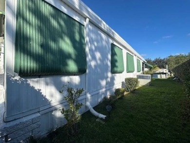 Turnkey 2-Bedroom, 2-Bath Home with Breathtaking Lake Views in on Vista Plantation Golf Club in Florida - for sale on GolfHomes.com, golf home, golf lot
