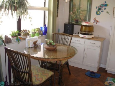 This 1st floor inside corner condo has an assigned parking spot on Sunrise Lakes Phase IV Golf Course in Florida - for sale on GolfHomes.com, golf home, golf lot