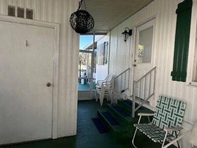 Turnkey 2-Bedroom, 2-Bath Home with Breathtaking Lake Views in on Vista Plantation Golf Club in Florida - for sale on GolfHomes.com, golf home, golf lot