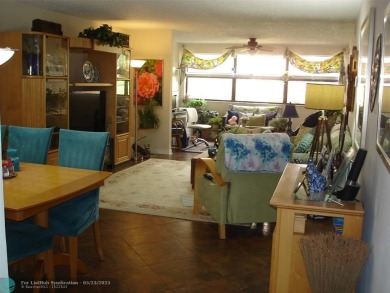 This 1st floor inside corner condo has an assigned parking spot on Sunrise Lakes Phase IV Golf Course in Florida - for sale on GolfHomes.com, golf home, golf lot