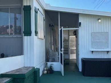 Turnkey 2-Bedroom, 2-Bath Home with Breathtaking Lake Views in on Vista Plantation Golf Club in Florida - for sale on GolfHomes.com, golf home, golf lot