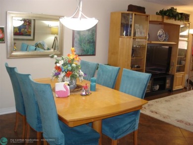 This 1st floor inside corner condo has an assigned parking spot on Sunrise Lakes Phase IV Golf Course in Florida - for sale on GolfHomes.com, golf home, golf lot