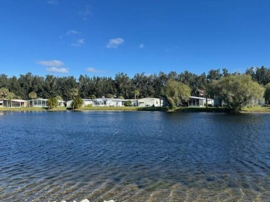 Turnkey 2-Bedroom, 2-Bath Home with Breathtaking Lake Views in on Vista Plantation Golf Club in Florida - for sale on GolfHomes.com, golf home, golf lot