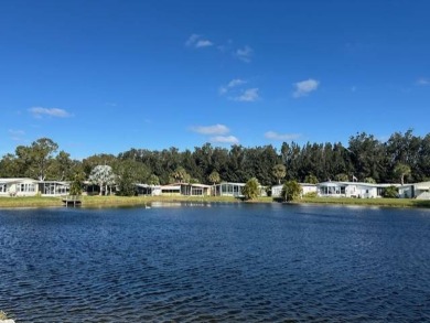 Turnkey 2-Bedroom, 2-Bath Home with Breathtaking Lake Views in on Vista Plantation Golf Club in Florida - for sale on GolfHomes.com, golf home, golf lot