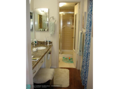 This 1st floor inside corner condo has an assigned parking spot on Sunrise Lakes Phase IV Golf Course in Florida - for sale on GolfHomes.com, golf home, golf lot