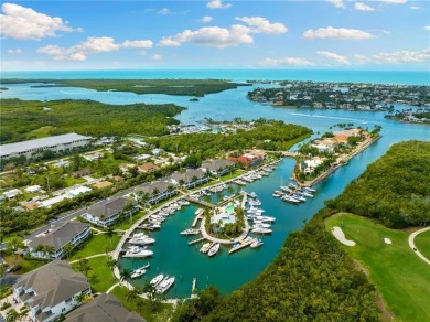 Enjoy spectacular golf course from this end unit, 2-bedroom on Windstar on Naples Bay in Florida - for sale on GolfHomes.com, golf home, golf lot