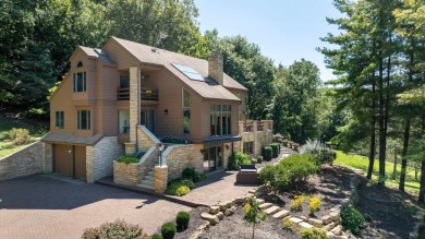 Nestled amidst the scenic beauty of mature trees and lush on Eagle Ridge Inn and Resort in Illinois - for sale on GolfHomes.com, golf home, golf lot