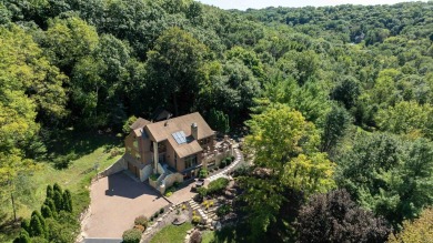 Nestled amidst the scenic beauty of mature trees and lush on Eagle Ridge Inn and Resort in Illinois - for sale on GolfHomes.com, golf home, golf lot