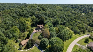 Nestled amidst the scenic beauty of mature trees and lush on Eagle Ridge Inn and Resort in Illinois - for sale on GolfHomes.com, golf home, golf lot