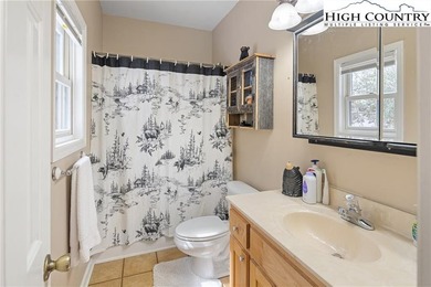 Private, light filled mountain retreat with golf course and on Mountain Aire Golf Course in North Carolina - for sale on GolfHomes.com, golf home, golf lot