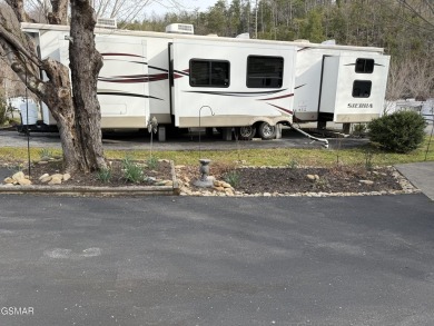 Beautifully landscaped VACANT lot in the middle of the park that on Bent Creek Golf Course in Tennessee - for sale on GolfHomes.com, golf home, golf lot