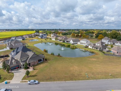 Experience lakeside living in the exclusive, gated community of on LeTriomphe Golf and Country Club in Louisiana - for sale on GolfHomes.com, golf home, golf lot