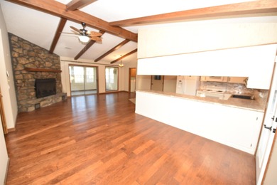 Beautiful one-level home in Fairfield Bay with stunning views of on Indian Hills Country Club in Arkansas - for sale on GolfHomes.com, golf home, golf lot