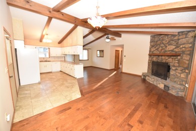 Beautiful one-level home in Fairfield Bay with stunning views of on Indian Hills Country Club in Arkansas - for sale on GolfHomes.com, golf home, golf lot