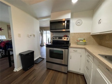 Fabulous 55+ Upstairs FURNISHED TURNKEY condo with great views on Country Club At Silver Springs Shores in Florida - for sale on GolfHomes.com, golf home, golf lot