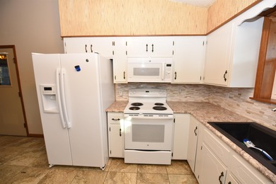 Beautiful one-level home in Fairfield Bay with stunning views of on Indian Hills Country Club in Arkansas - for sale on GolfHomes.com, golf home, golf lot