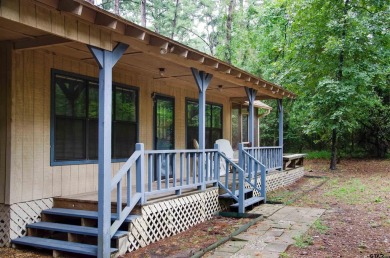 Discover the perfect retreat offering the peace, safety, and on Holly Lake Ranch Golf Club in Texas - for sale on GolfHomes.com, golf home, golf lot