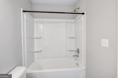 This beautifully maintained 3-bedroom, 2.5-bath townhome in the on Browns Mill Golf Course in Georgia - for sale on GolfHomes.com, golf home, golf lot