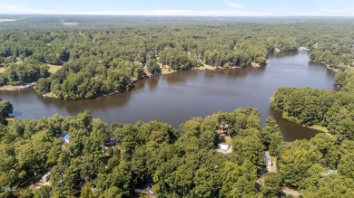 Discover a pristine 0.14-acre lot tucked away on a quiet private on River Golf and Country Club at Lake Royale in North Carolina - for sale on GolfHomes.com, golf home, golf lot