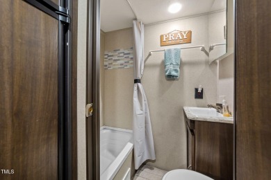 Discover a pristine 0.14-acre lot tucked away on a quiet private on River Golf and Country Club at Lake Royale in North Carolina - for sale on GolfHomes.com, golf home, golf lot