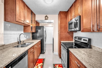 Spacious 3-bedroom, 2-bath corner unit located on the top floor on Woodlands Country Club in Florida - for sale on GolfHomes.com, golf home, golf lot