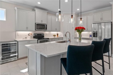 DESIGNER HOME WITH LAKE VIEW, OVERSIZED THREE CAR GARAGE & on Bonita National Golf Course in Florida - for sale on GolfHomes.com, golf home, golf lot