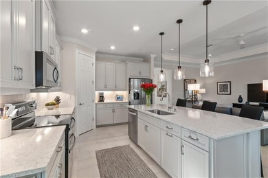 DESIGNER HOME WITH LAKE VIEW, OVERSIZED THREE CAR GARAGE & on Bonita National Golf Course in Florida - for sale on GolfHomes.com, golf home, golf lot