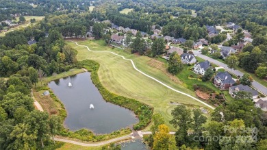 Nestled within the prestigious Verdict Ridge golf community on Verdict Ridge Golf and Country Club in North Carolina - for sale on GolfHomes.com, golf home, golf lot