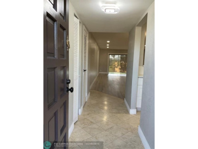 This beautifully remodeled condo in a gated community provides on Inverrary Country Club in Florida - for sale on GolfHomes.com, golf home, golf lot