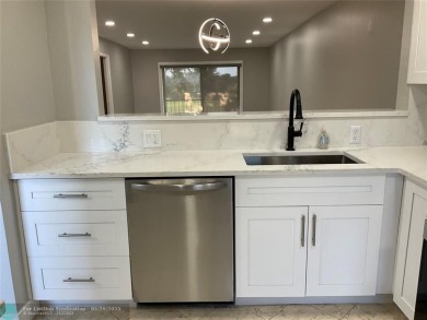 This beautifully remodeled condo in a gated community provides on Inverrary Country Club in Florida - for sale on GolfHomes.com, golf home, golf lot