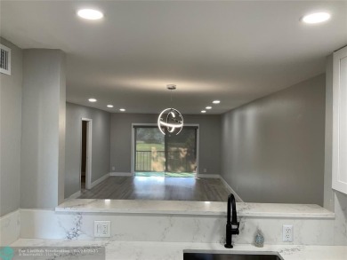 This beautifully remodeled condo in a gated community provides on Inverrary Country Club in Florida - for sale on GolfHomes.com, golf home, golf lot