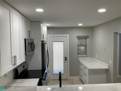 This beautifully remodeled condo in a gated community provides on Inverrary Country Club in Florida - for sale on GolfHomes.com, golf home, golf lot