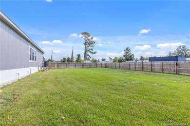 Step into luxury with this stunning custom-built manufactured on The National Golf Club of Louisiana in Louisiana - for sale on GolfHomes.com, golf home, golf lot