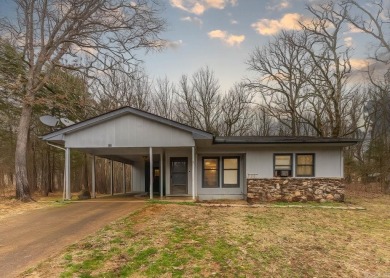 Discover the charm of this 2-bedroom, 1-bath home in the on Cherokee Village North Course in Arkansas - for sale on GolfHomes.com, golf home, golf lot