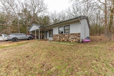 Discover the charm of this 2-bedroom, 1-bath home in the on Cherokee Village North Course in Arkansas - for sale on GolfHomes.com, golf home, golf lot